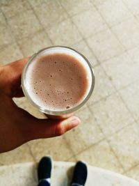 High angle view of coffee cup on floor