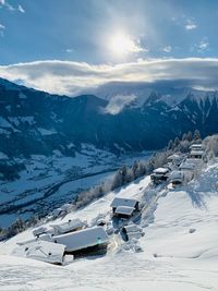 Scenic view of snow covered mountains against sky