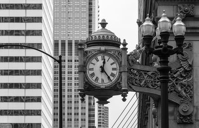 Low angle view of clock tower against sky