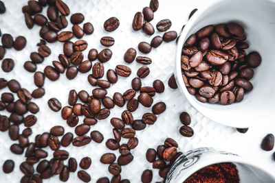 Close-up of roasted coffee beans on table