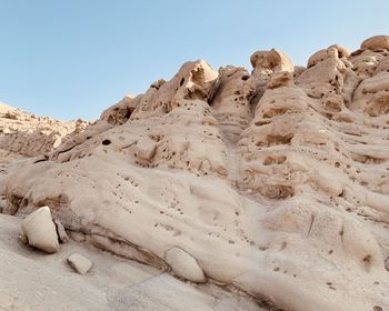 Rock formations in desert against sky