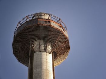 Low angle view of water tower against clear sky