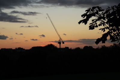 Silhouette trees against sky during sunset