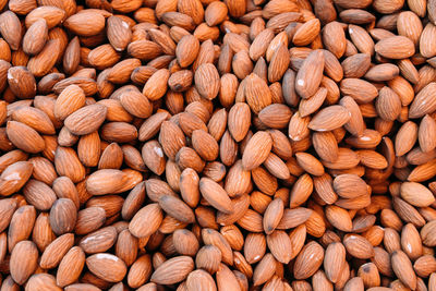 Lots of shelled almond nuts on a farmer's market stall