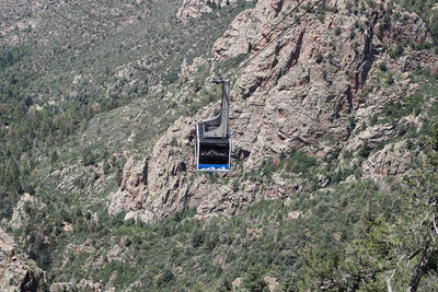 Overhead cable car on rocky mountains
