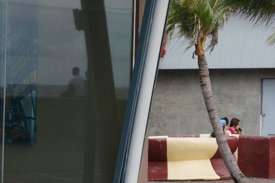 Man looking through window