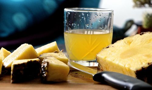 Close-up of pineapple slices and juice