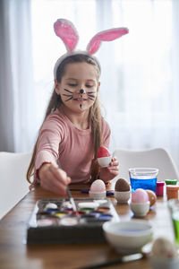 Portrait of boy playing with toys on table