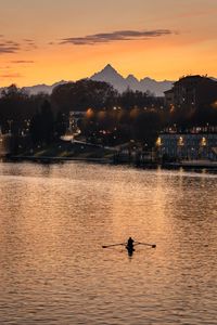 Scenic view of lake against sky during sunset