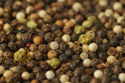 Mixed whole peppercorns close-up