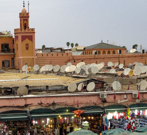 Group of people in front of buildings in city