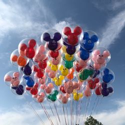 Low angle view of balloons against sky