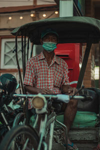 Tricycle taxi that has to be adapted during the covid 19 era in thailand