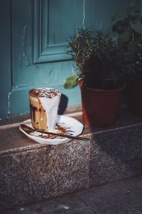 Coffee in glass at entrance