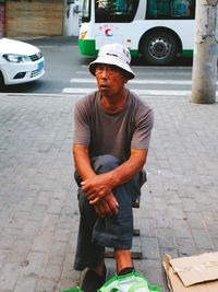 Man looking at city street