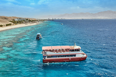 High angle view of ship sailing on sea against sky