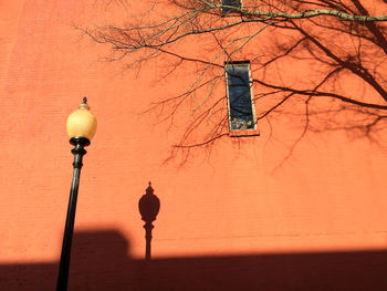 Low angle view of street light against sky