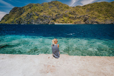 Rear view of woman on beach