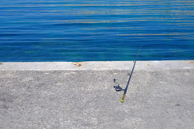 High angle view of fishing rod at sea