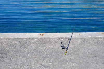 High angle view of man fishing in sea