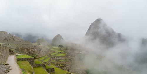 Rocky mountains at machu picchu during foggy weather