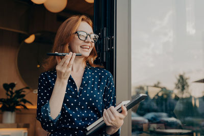 Young woman using mobile phone
