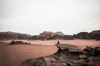 Rock formations on land against sky