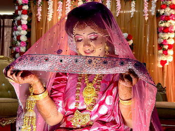 Portrait of young woman standing in temple