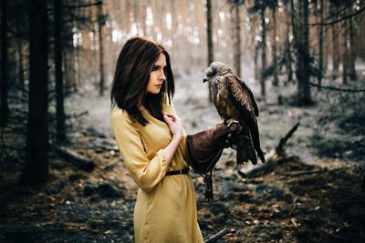 Portrait of young woman in forest