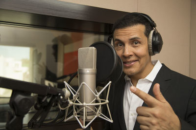 Portrait of smiling man using mobile phone
