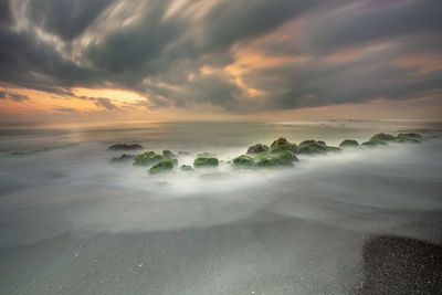 Scenic view of sea against sky during sunset