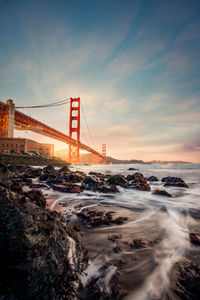 Long exposure of low angle view with sunset golden gate bridge 