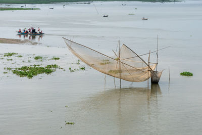 People fishing on beach