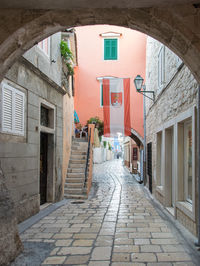 Narrow alley amidst buildings in town