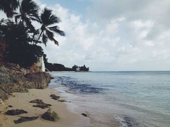 Scenic view of sea against cloudy sky