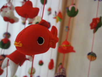 Close-up of red decoration hanging at home