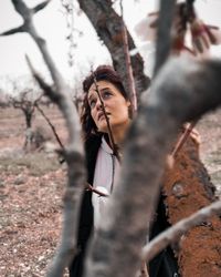 Portrait of woman looking away outdoors