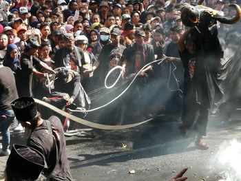 Group of people dancing on street