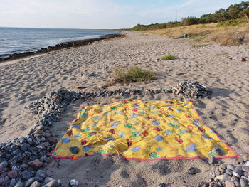 High angle view of pebbles on beach against sky