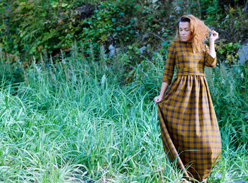Woman standing in grass
