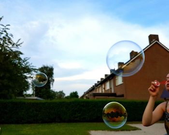 Blowing soap bubbles in summer