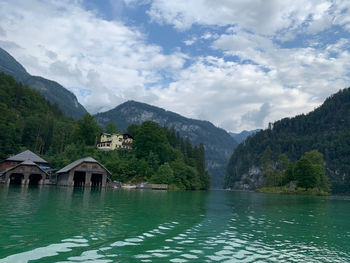 Scenic view of lake and mountains against sky