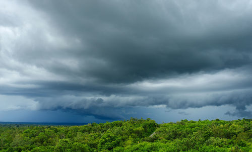 Scenic view of landscape against cloudy sky