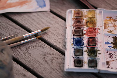 High angle view of paintbrushes on table