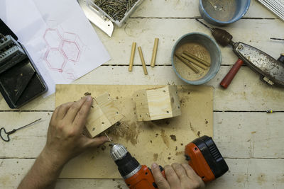 High angle view of person working on floor