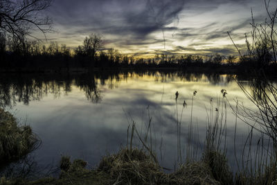 Scenic view of lake against sky during sunset