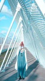 Portrait of man standing on bridge
