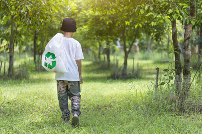 Rear view of man standing on field