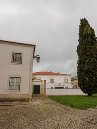 Exterior of house on field against sky