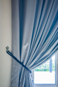 Curtain by window at home